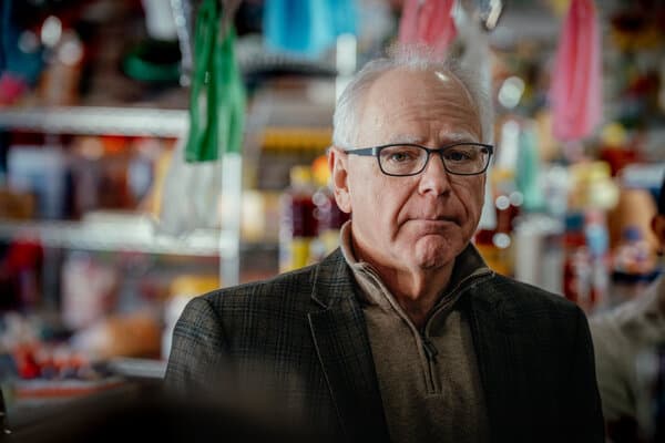 Minnesota Governor Tim Walz speaking at a podium