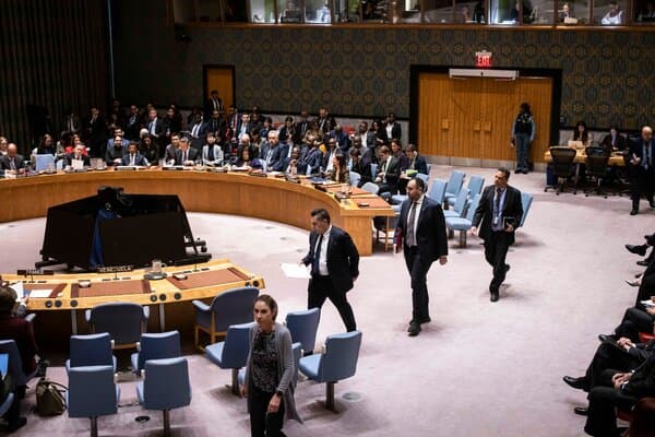 United Nations Security Council meeting in progress with delegates discussing US actions in Venezuela.