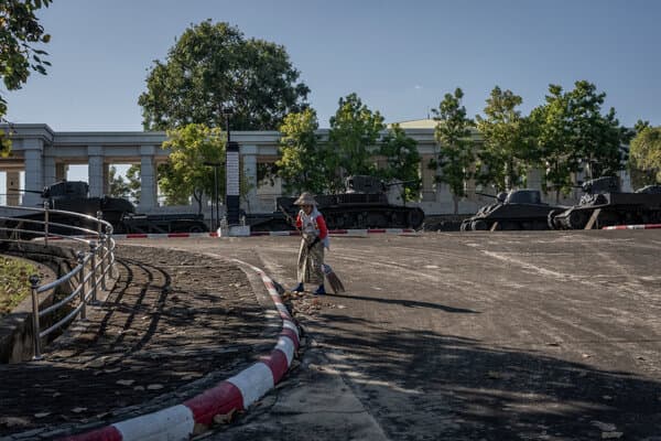 A wide, empty boulevard in Naypyidaw, Myanmar, showcasing the capital's vast emptiness and neglect.