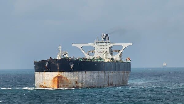 U.S. Coast Guard approaching a Russian oil tanker in open waters during the seizure operation