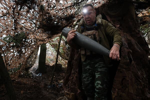 World leaders looking concerned while examining a map