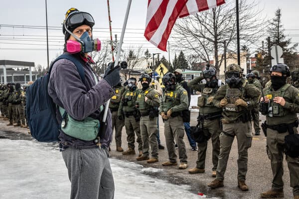 Protesters gathering in Minneapolis streets following a fatal shooting involving ICE agents.