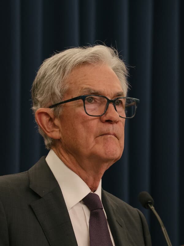 Federal Reserve officials reviewing economic charts and labor market data