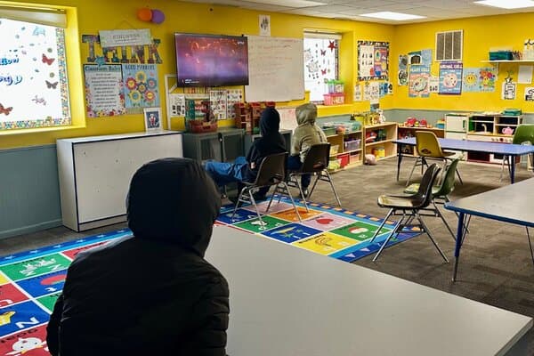 A judge's gavel resting on a desk in front of stacks of legal documents and financial records