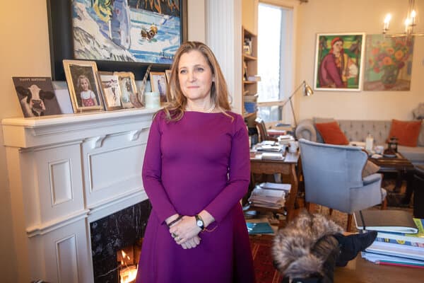 Chrystia Freeland standing at a podium during a political event.