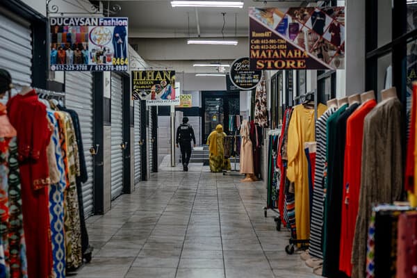 Somali community members gathered in a Minneapolis shopping mall, looking concerned